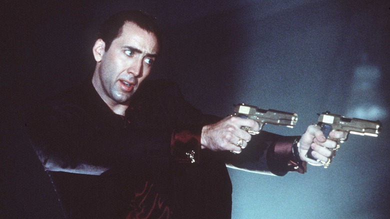 Nic Cage dual wields guns