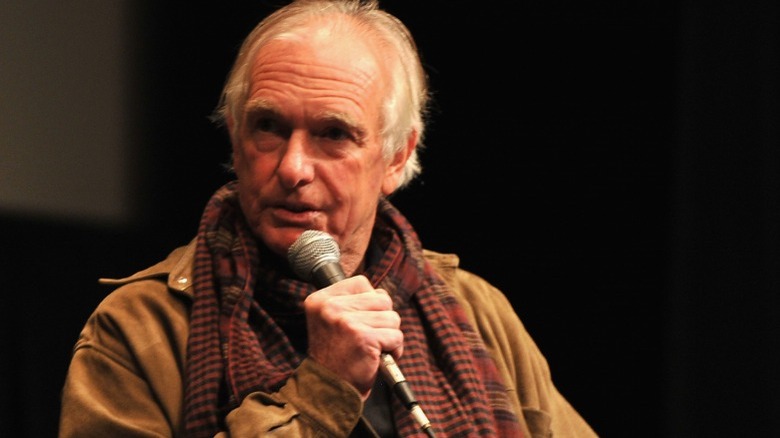 Peter Weir speaking into microphone