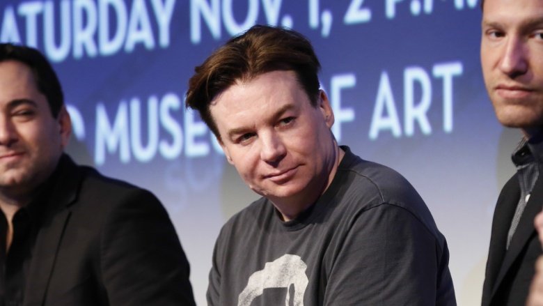 Mike Myers smirking, looking to his left