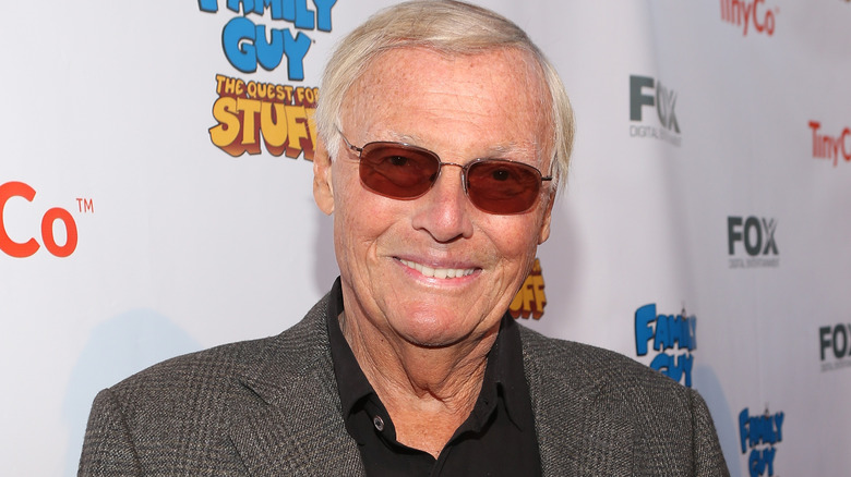 Adam West smiles