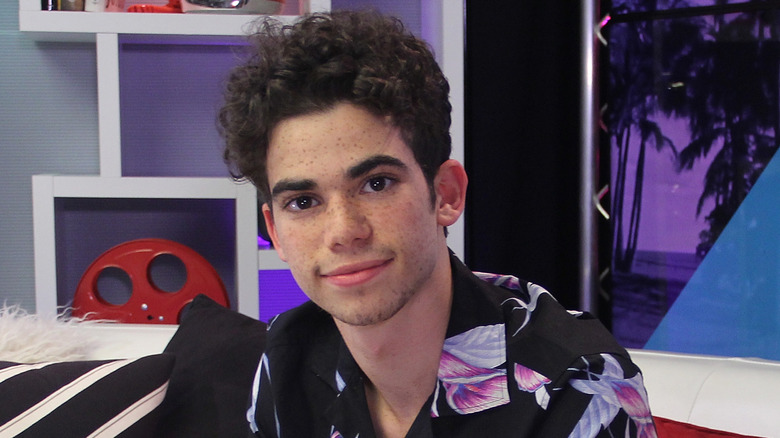 Cameron Boyce sitting