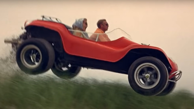 Steve McQueen drives dune buggy