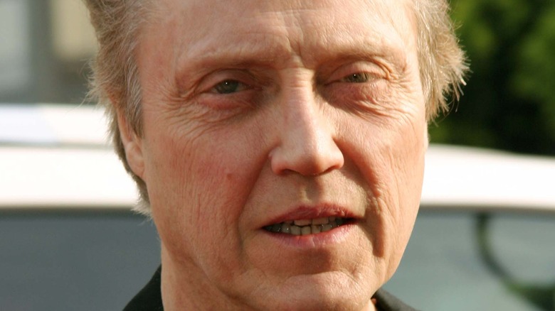 Walken looks on