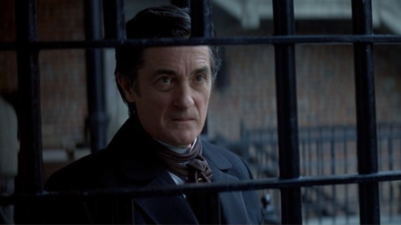 Roger Rees behind prison bars