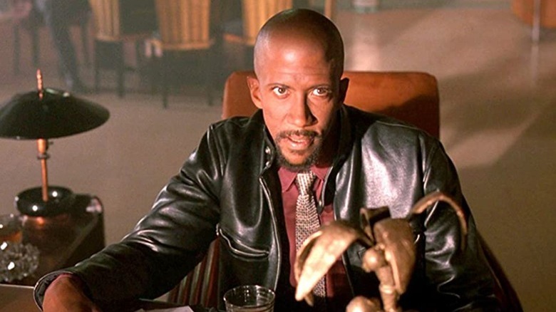 Reg E. Cathey in a leather jacket