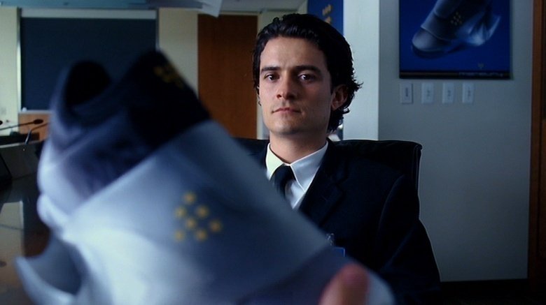 Orlando Bloom looking at shoe