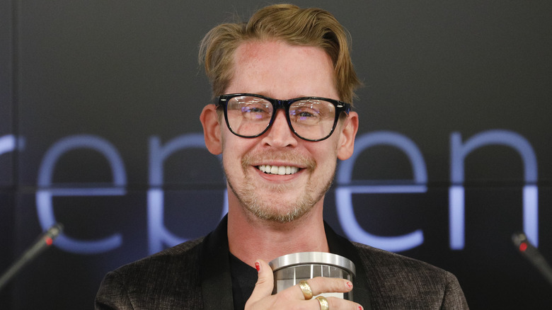 Macaulay Culkin smiles