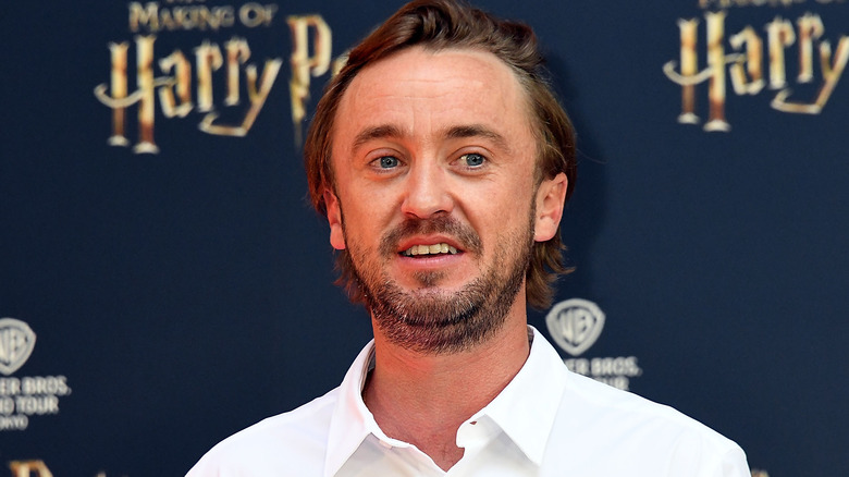 Tom Felton poses for a picture