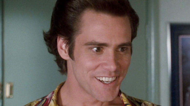 Jim Carrey smiles as Ace Ventura