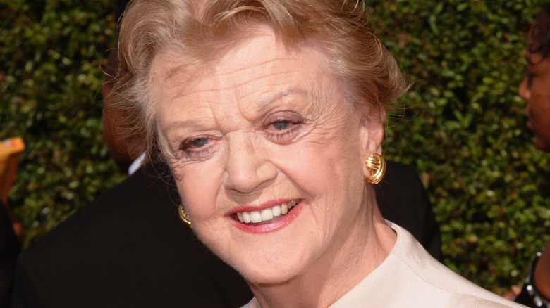 Angela Lansbury wearing gold earrings