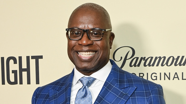 Andre Braugher smiling blue suit