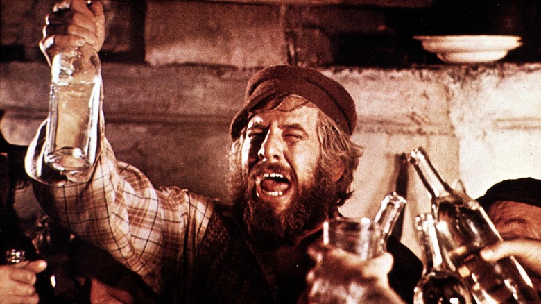 Tevye raising bottle