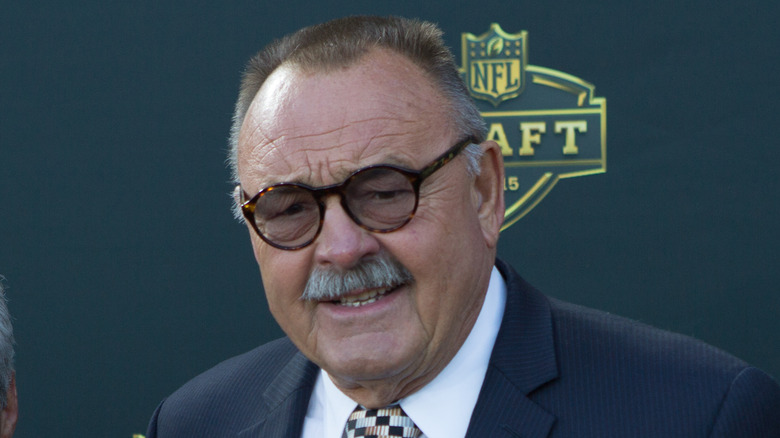 Dick Butkus wearing tortoiseshell glasses