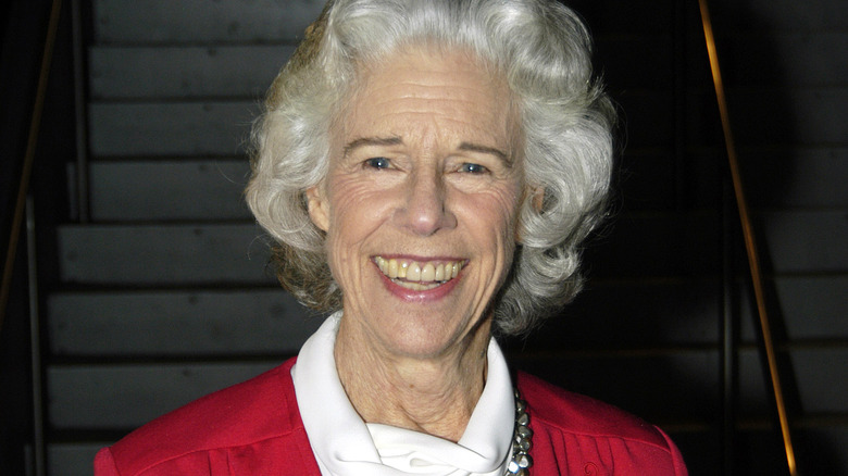 Frances Sternhagen red coat smiling