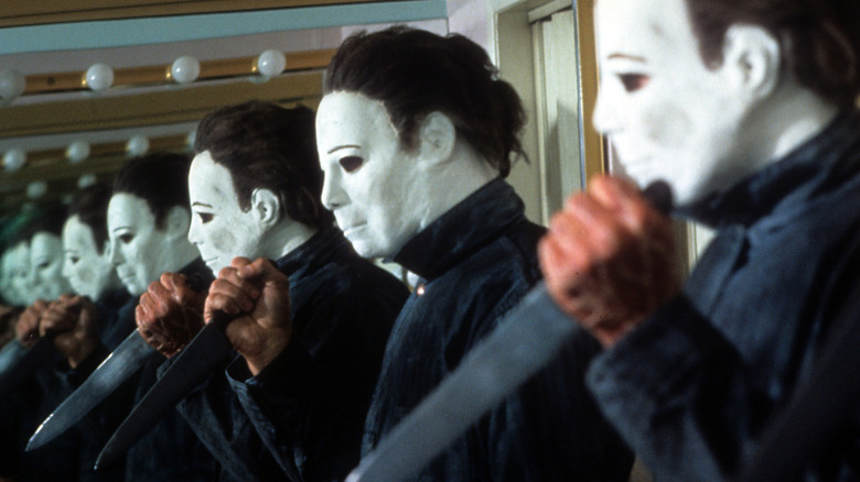 Michael Myers standing beside mirror