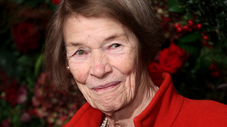 Glenda Jackson smiling red coat