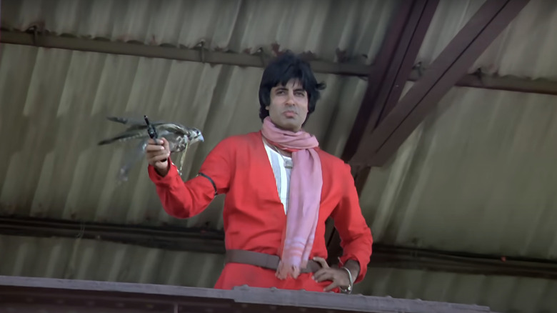 Iqbal Khan holding revolver