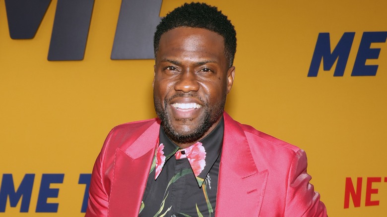 Kevin Hart smiling in suit