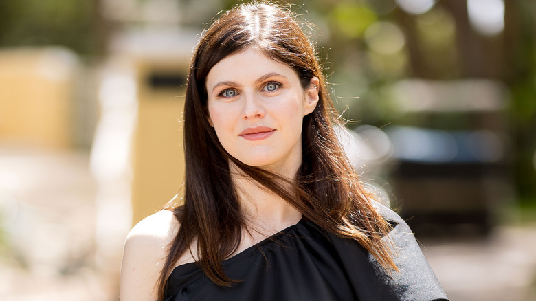 Alexandra Daddario posing in black