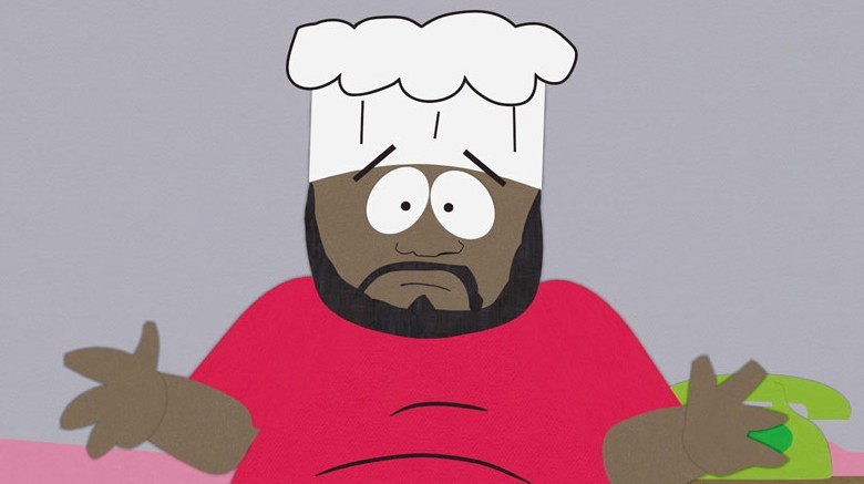 Chef wearing red shirt and hat