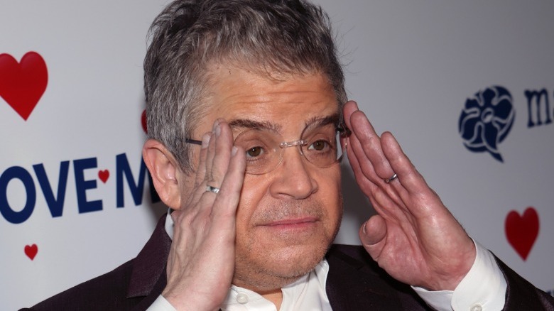 Patton Oswalt holding his head