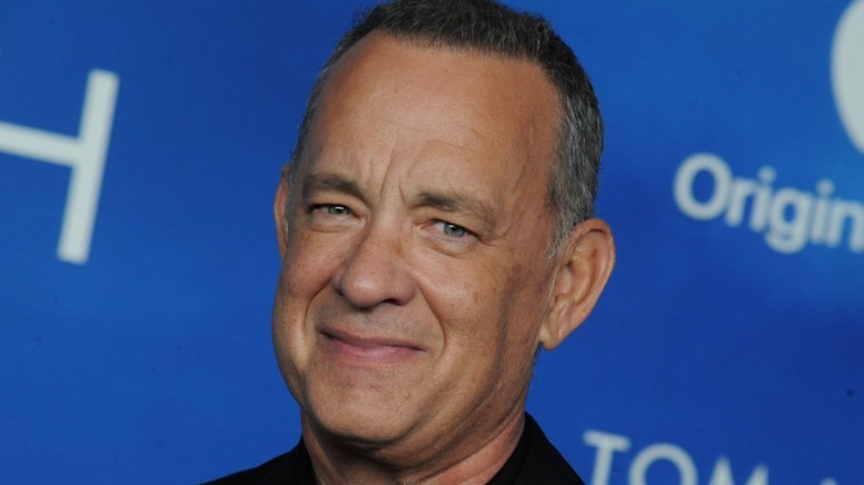 Tom Hanks wryly smiling