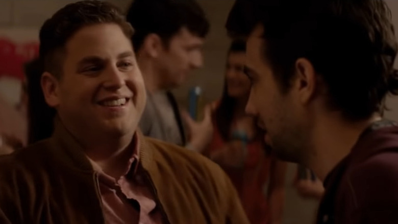 Jonah Hill smiling at Jay Baruchel in This Is the End