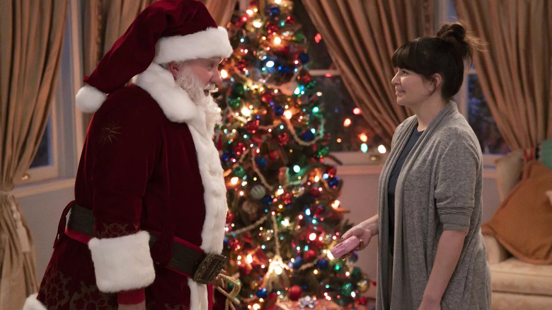 Santa Claus (Tim Allen) talking to Sara (Casey Wilson) on The Santa Clauses