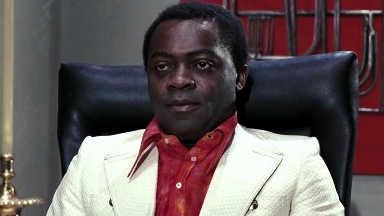 Dr. Kananga wearing a suit