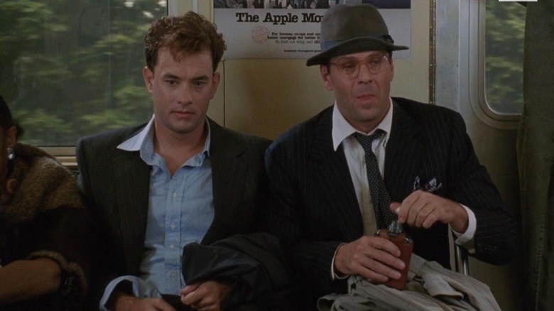 Tom Hanks and Bruce Willis ride the train in The Bonfire of the Vanities