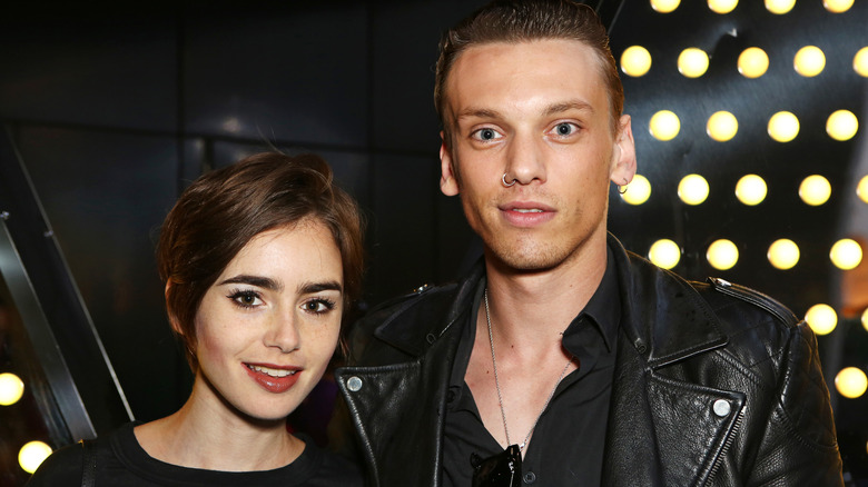 Lily Collins and Jamie Campbell Bower smiling