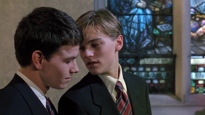Leonardo DiCaprio whispers to Mark Wahlberg
