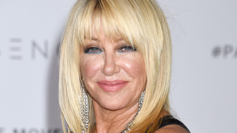 Suzanne Somers with diamond earrings on red carpet