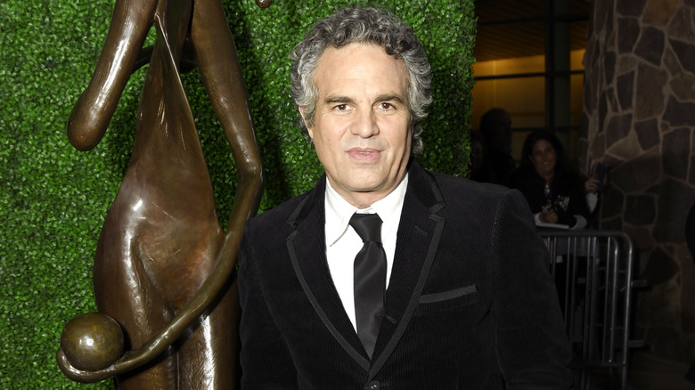 Mark Ruffalo standing by statue