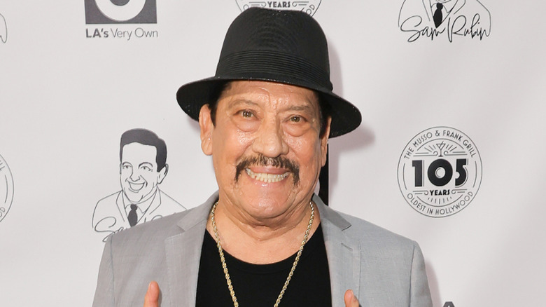 Danny Trejo smiles at a tribute to TV anchor Sam Rubin in Hollywood, California in 2024