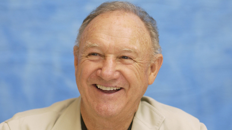 Gene Hackman smiles during a press conference