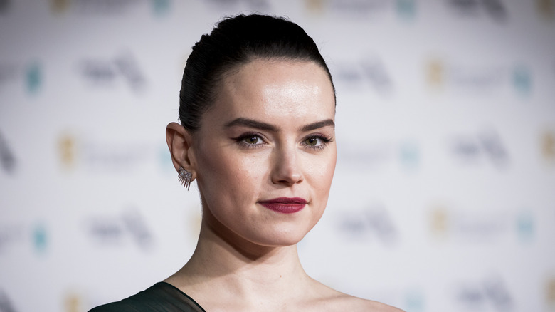 Daisy Ridley half-smiling