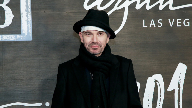 Billy Bob Thornton in black hat and coat on red carpet