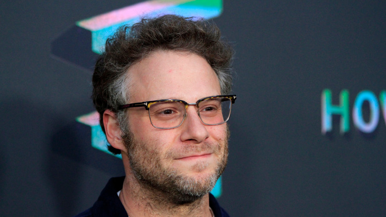 Rogen grinning on red carpet