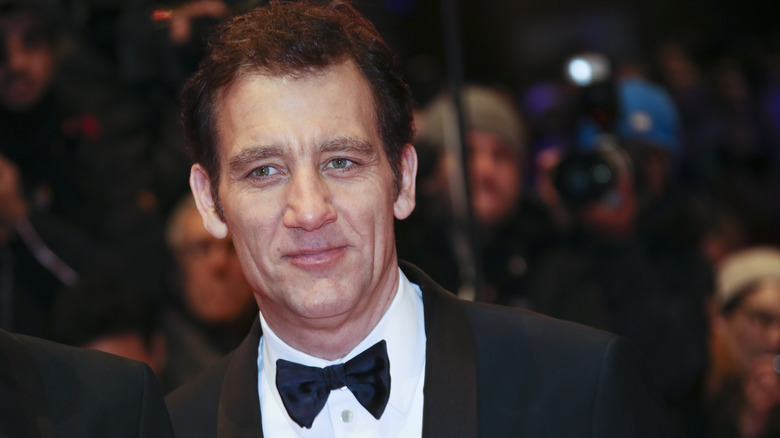 Clive Owen smiling in tuxedo