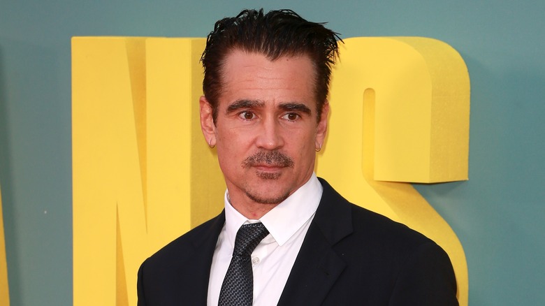 Colin Farrell posing in suit