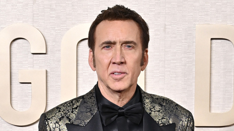 Nicolas Cage posing in suit