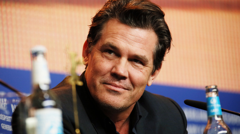 Josh Brolin leans forward