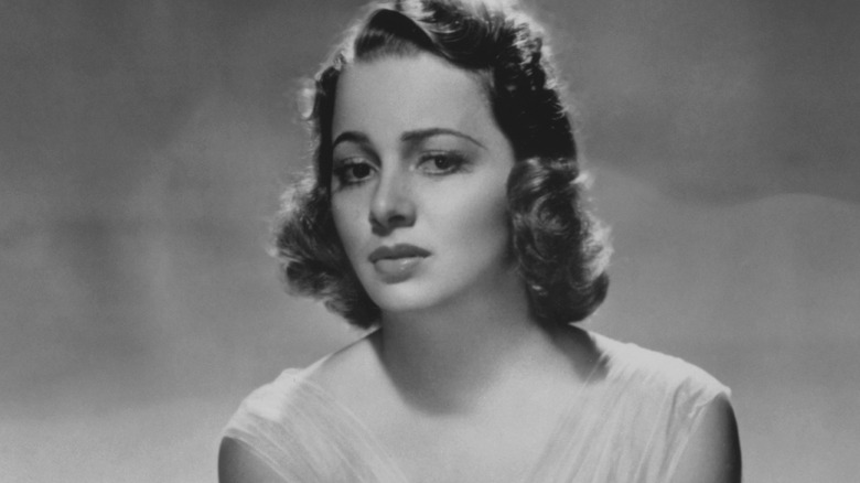 Olivia De Havilland looking worried