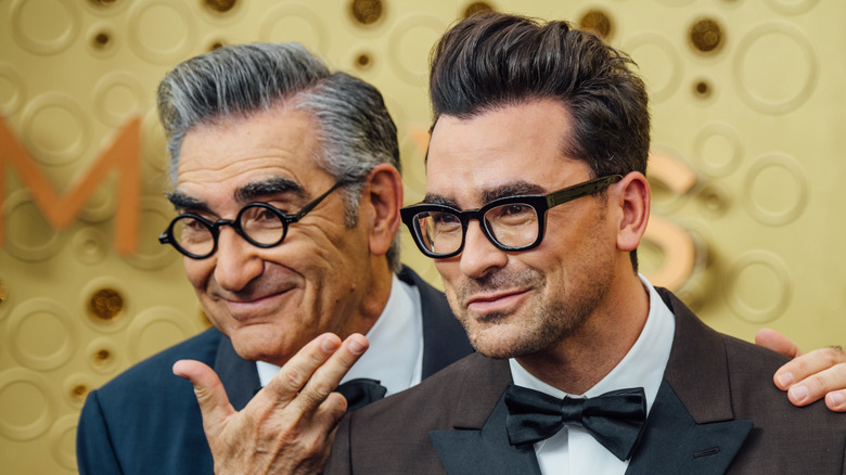 Eugene and Dan Levy pose