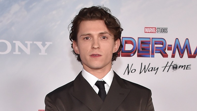 Tom Holland wears a suit