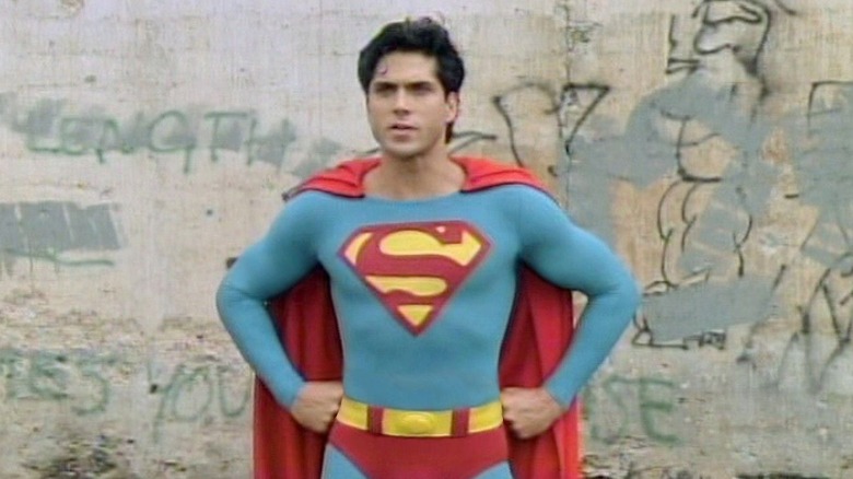 Superboy in front of a wall