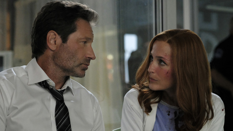 Mulder looks at Scully