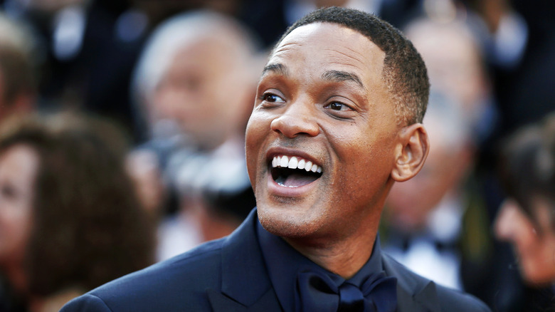 Will Smith smiling on red carpet