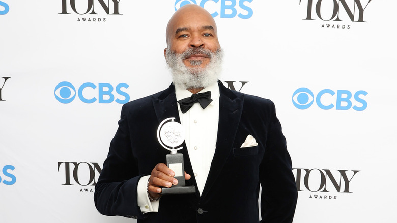 Grier posing with Tony award